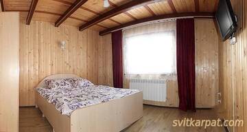 Фото номера Двухместный номер с 1 кроватью Лоджи Солнечный котедж г. Славское 3