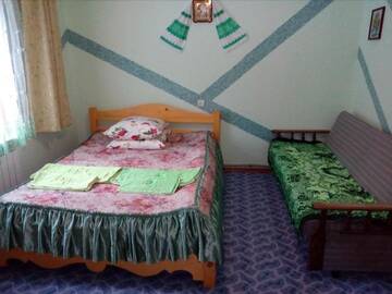 Фото номера Двухместный номер с двуспальной кроватью и дополнительной кроватью Проживание в семье Домашній затишок г. Славское 5